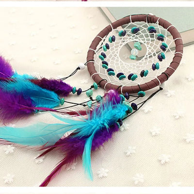 Atrapasueños turquesa con colgantes decorativos
