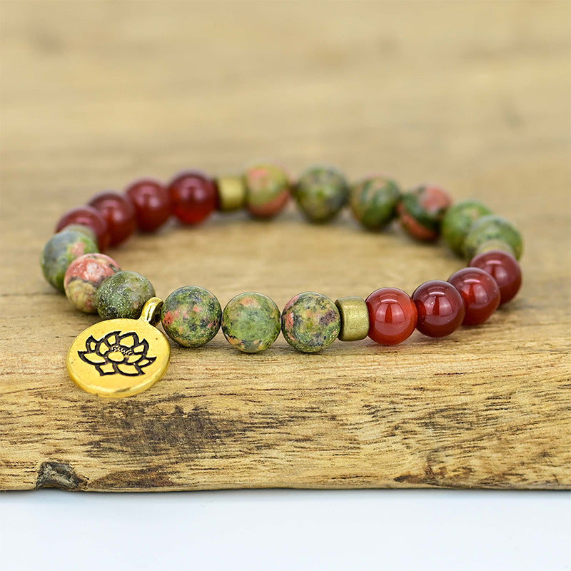 Pulsera de ágata roja con flor de loto – Energía y equilibrio interior
