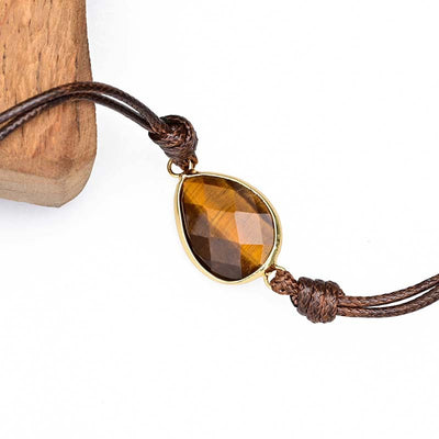 Pulsera envuelta en cuerda de parafina con colgante de ojo de tigre