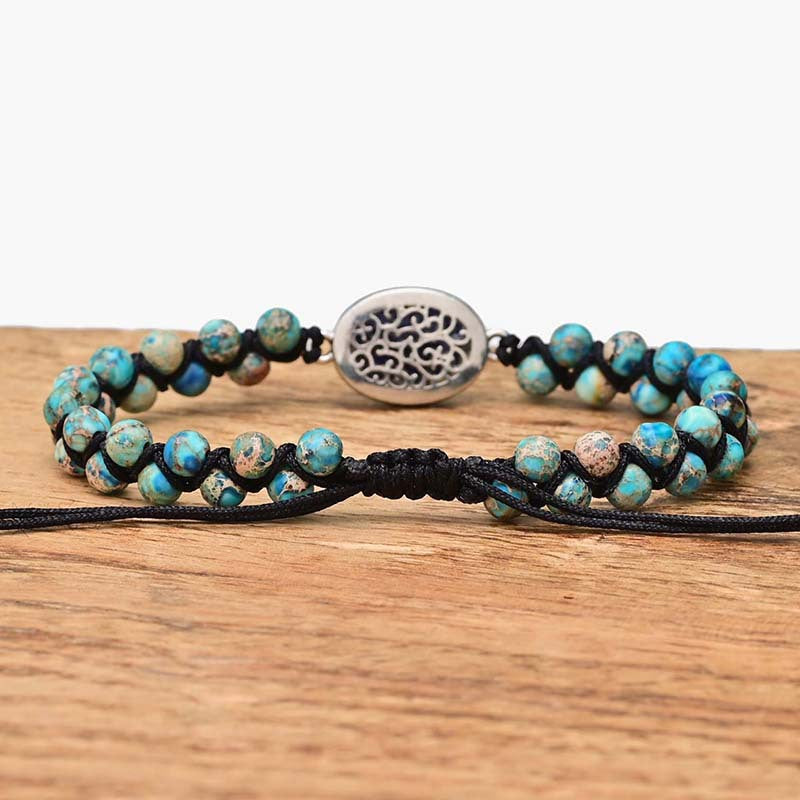 Pulsera Trenzada con Centro Iridiscente y Cuentas Jaspeadas