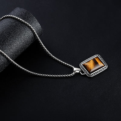 Collar de Ámbar y Acero de Titanio: Fuerza, Estilo y Distinción Masculina