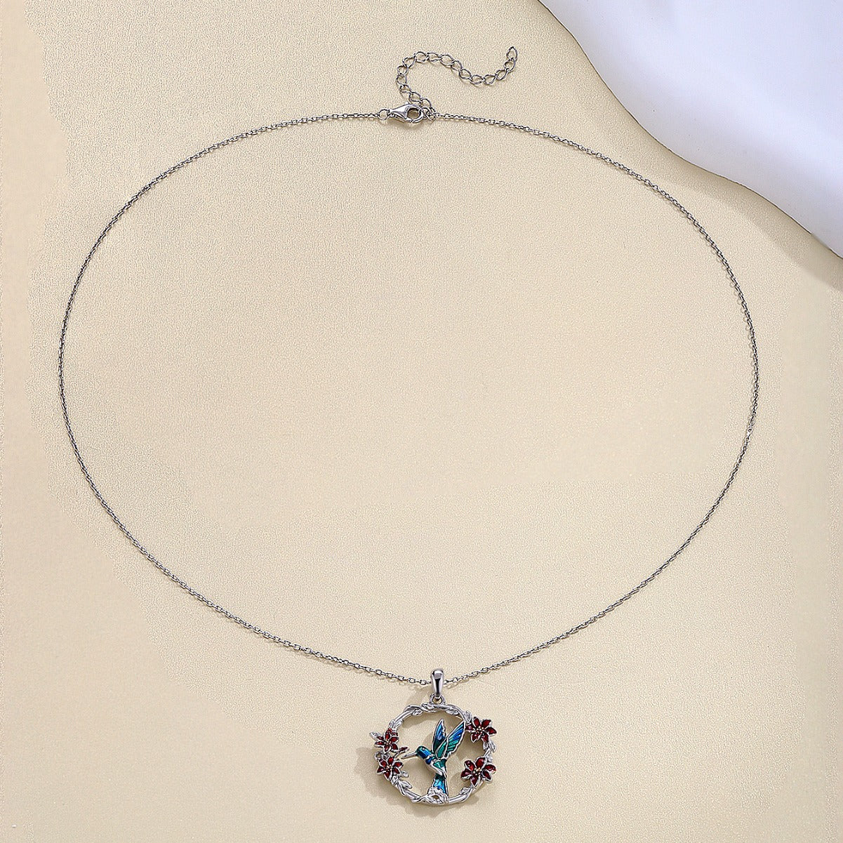 Collar colibrí y flor en plata 925, símbolo de alegría y amor por la vida
