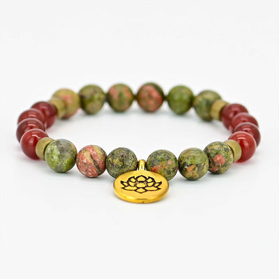 Pulsera de ágata roja con flor de loto – Energía y equilibrio interior