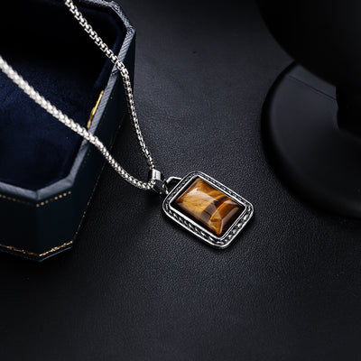 Collar de Ámbar y Acero de Titanio: Fuerza, Estilo y Distinción Masculina