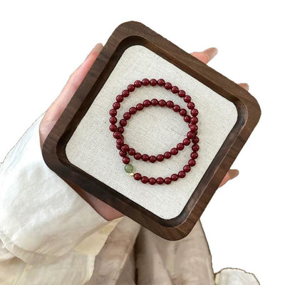 Pulsera auspiciosa de cinabrio y turmalina verde: protección y prosperidad