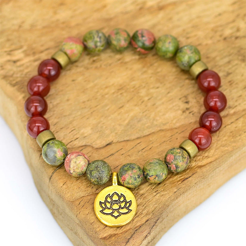 Pulsera de ágata roja con flor de loto – Energía y equilibrio interior
