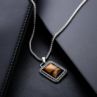 Collar de Ámbar y Acero de Titanio: Fuerza, Estilo y Distinción Masculina