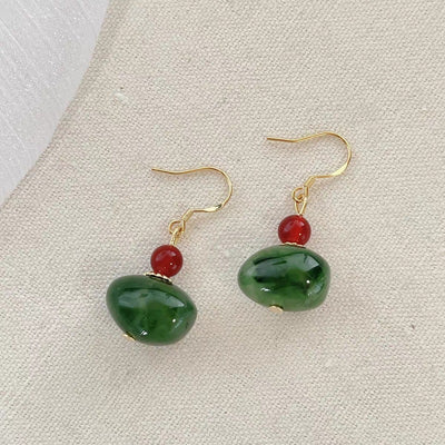 Pendientes de turmalina verde y jade rojo: energía, elegancia y bienestar