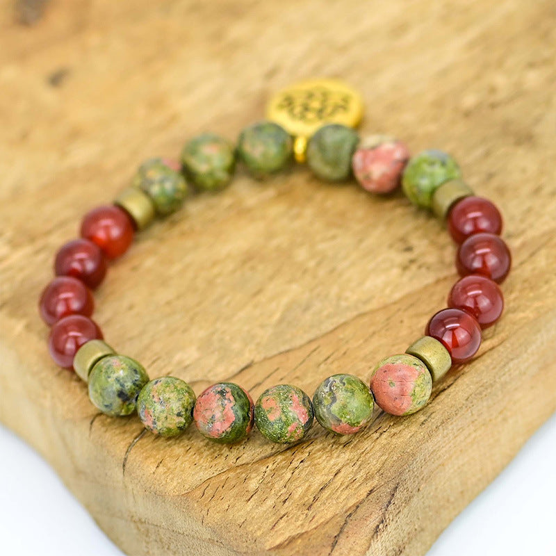 Pulsera de ágata roja con flor de loto – Energía y equilibrio interior