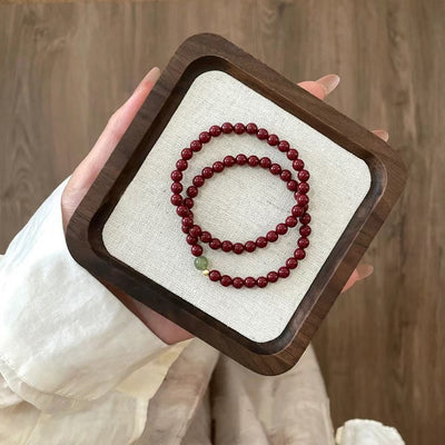 Pulsera auspiciosa de cinabrio y turmalina verde: protección y prosperidad