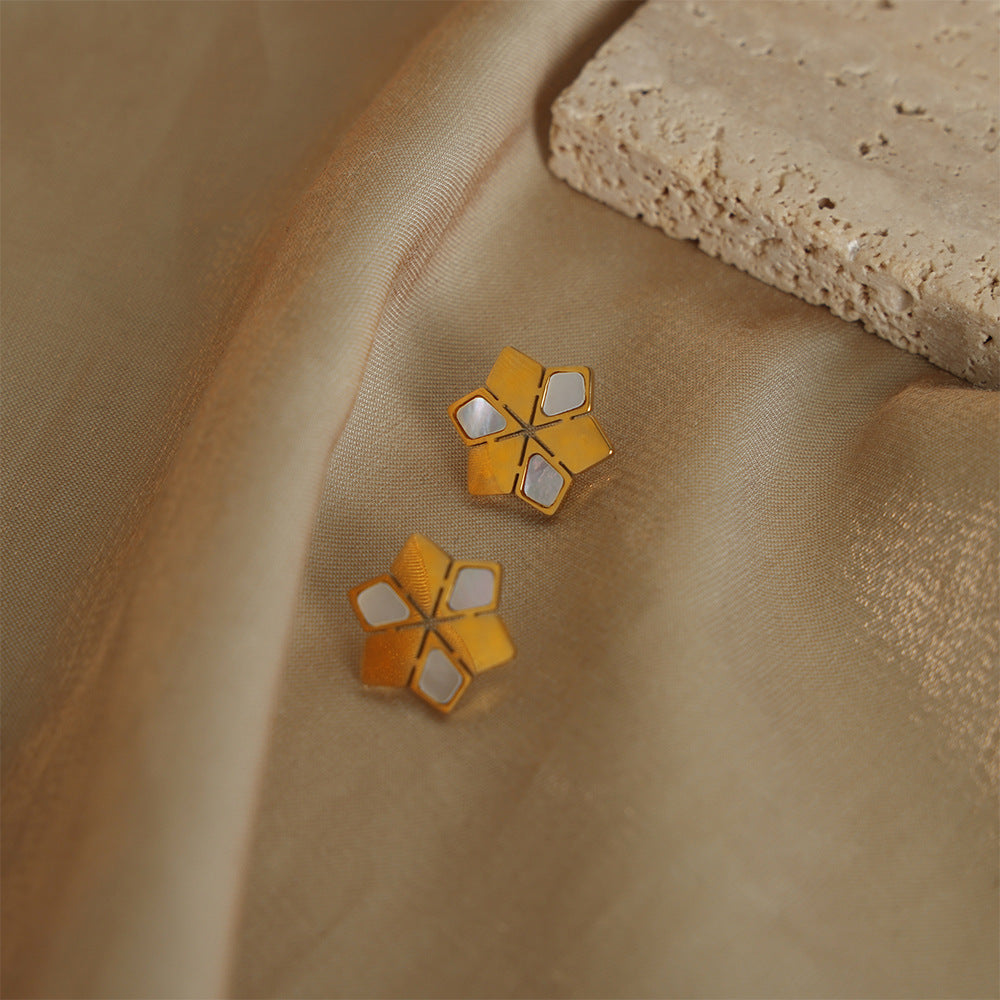 Pendientes de acero de titanio: Energía pura y luz en tu día a día