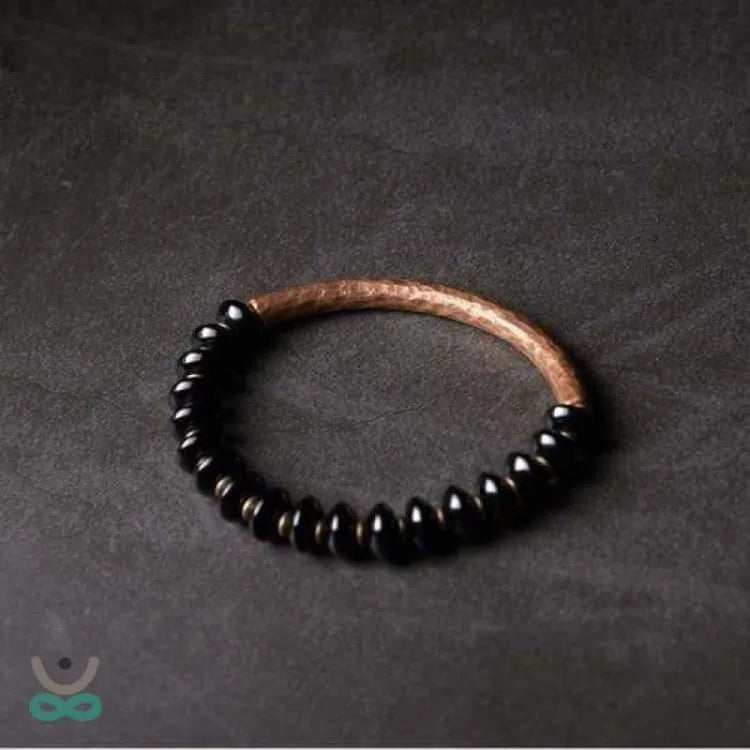 Pulsera "Resiliencia" en Cobre y Ónix – Fuerza, Equilibrio y Protección