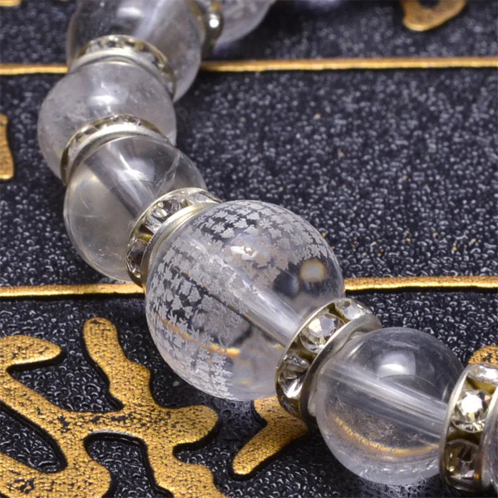 Pulsera Tibetana de Cristal Natural Grabado – Elegancia y Energía en una Joya Única