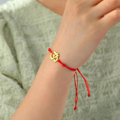 Pulsera budista con el símbolo OM