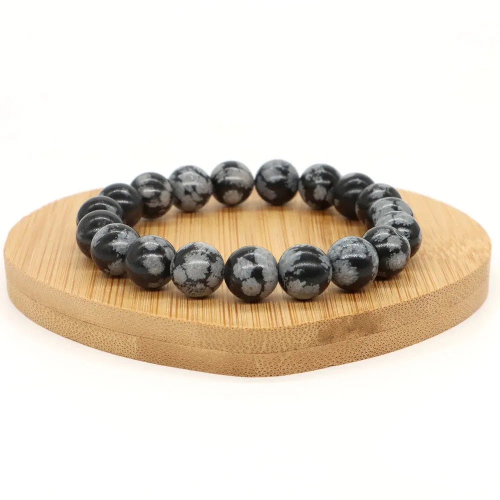 Pulsera de hombre de perlas negras con copos de nieve