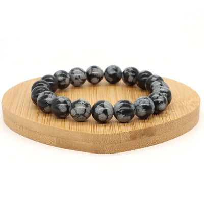 Pulsera de hombre de perlas negras con copos de nieve