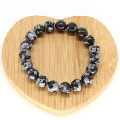 Pulsera de hombre de perlas negras con copos de nieve