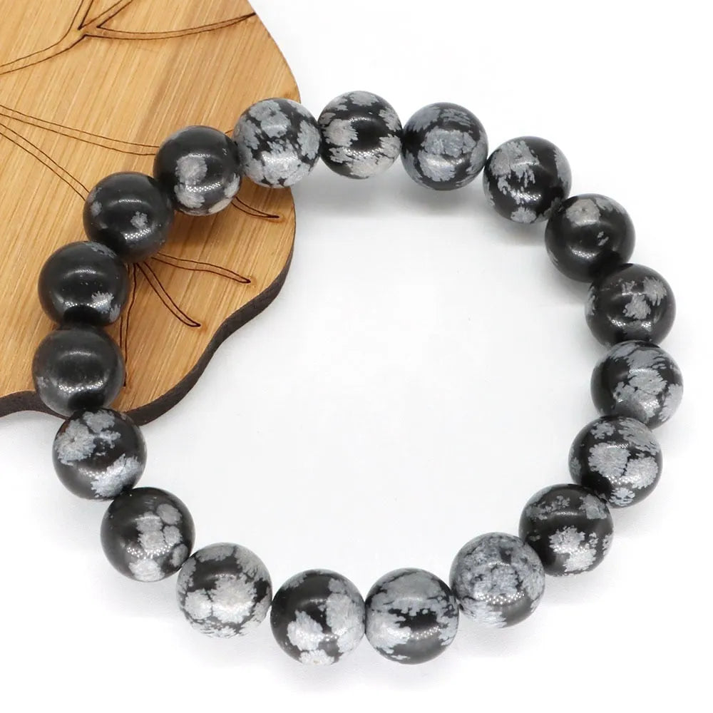 Pulsera de hombre de perlas negras con copos de nieve
