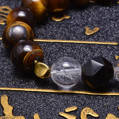 Pulsera de ojo de tigre con bola de cristal