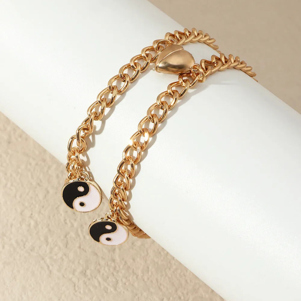 Pulsera dorada de pareja con colgante yin yang