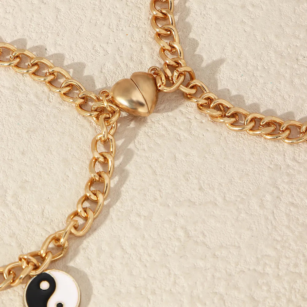Pulsera dorada de pareja con colgante yin yang