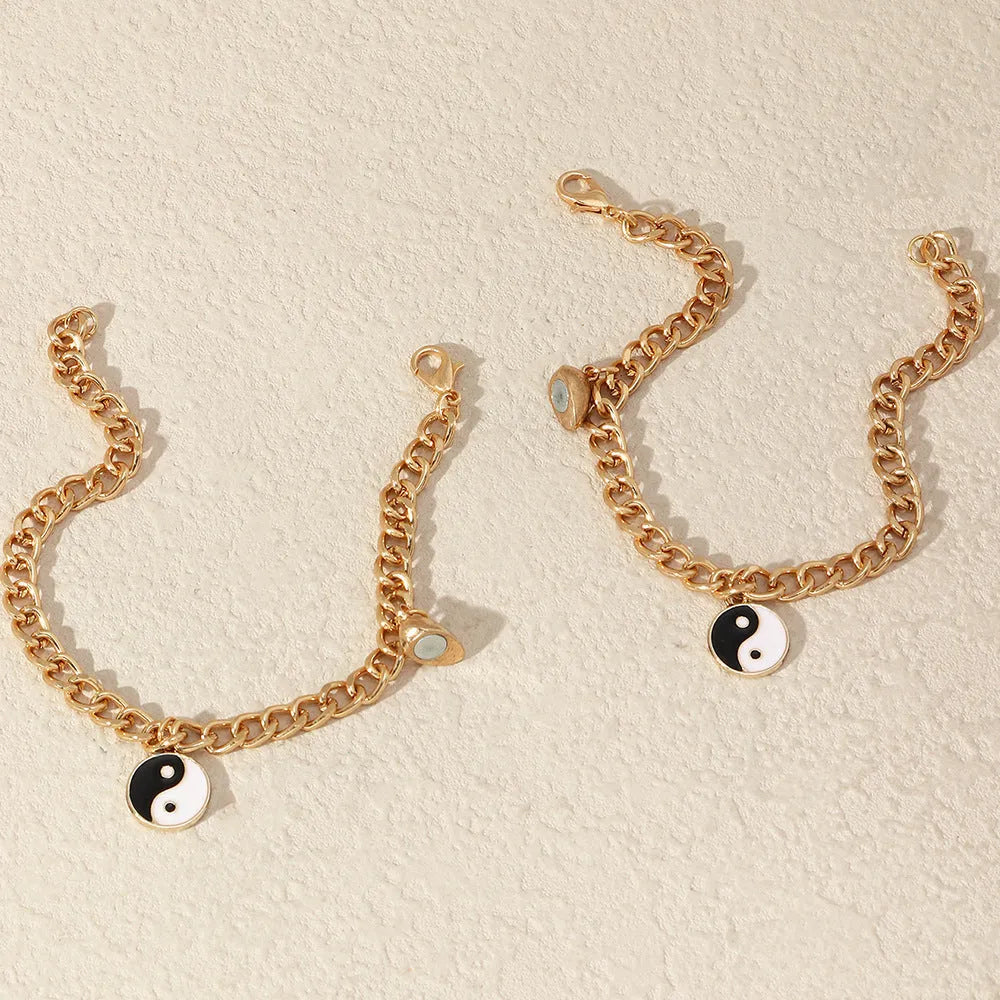 Pulsera dorada de pareja con colgante yin yang