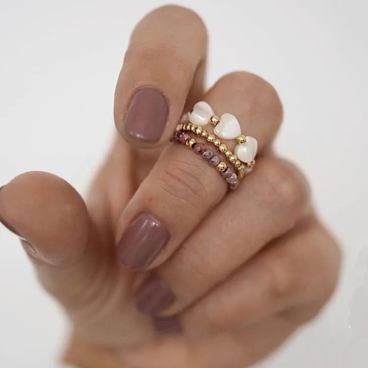 Trío de anillos de rodocrosita y perlas